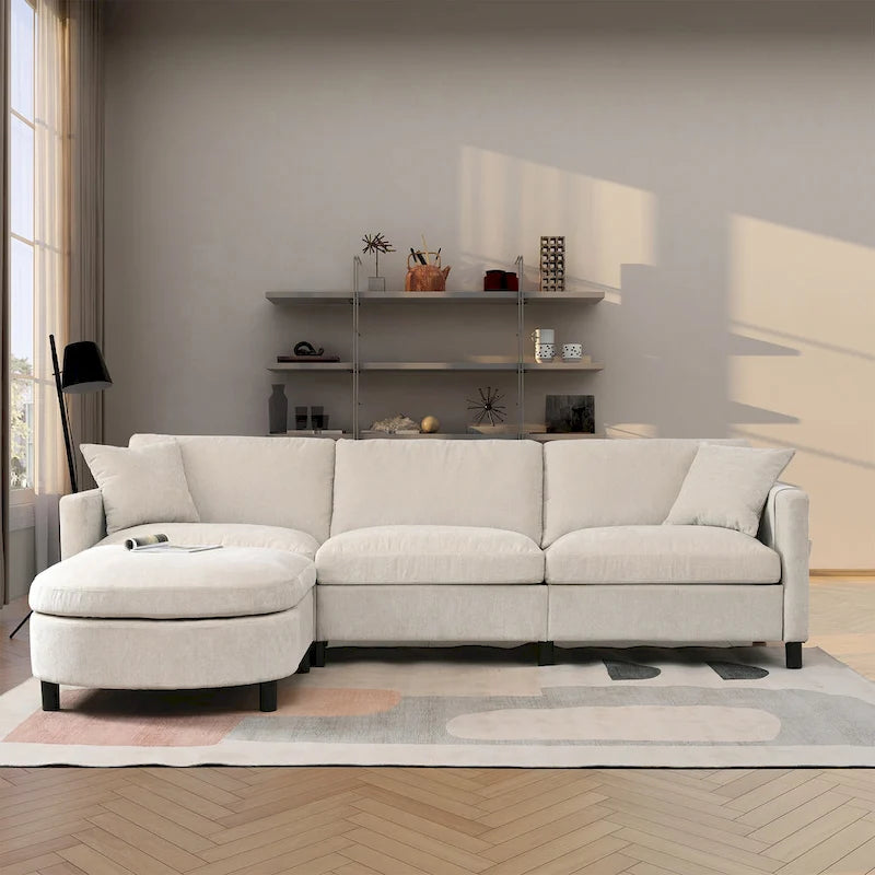 Canapé d'angle en tissu beige avec pouf rond mobile et accoudoir-sac