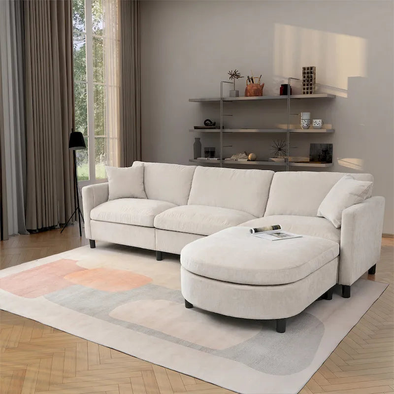 Canapé d'angle en tissu beige avec pouf rond mobile et accoudoir-sac