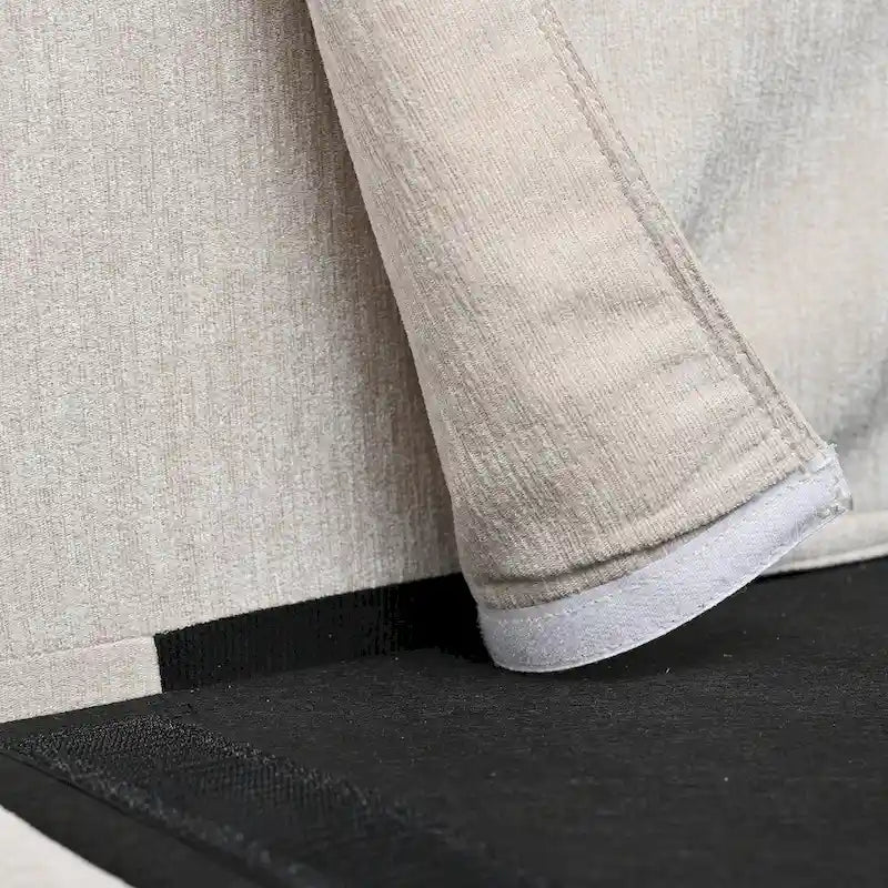 Canapé d'angle en tissu beige avec pouf rond mobile et accoudoir-sac