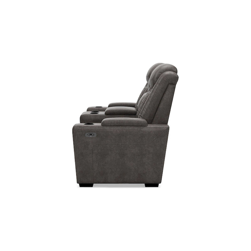 Causeuse inclinable électrique grise avec console porte-gobelets en similicuir surpiqué motif diamant