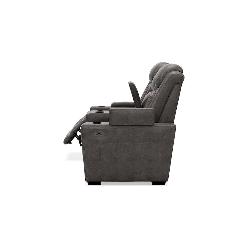 Causeuse inclinable électrique grise avec console porte-gobelets en similicuir surpiqué motif diamant