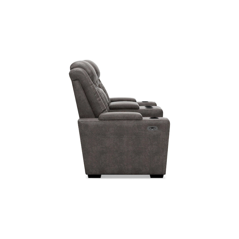 Causeuse inclinable électrique grise avec console porte-gobelets en similicuir surpiqué motif diamant