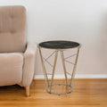 Table d'appoint ronde avec plateau en verre imitation marbre noir et piètement géométrique en métal couleur champagne